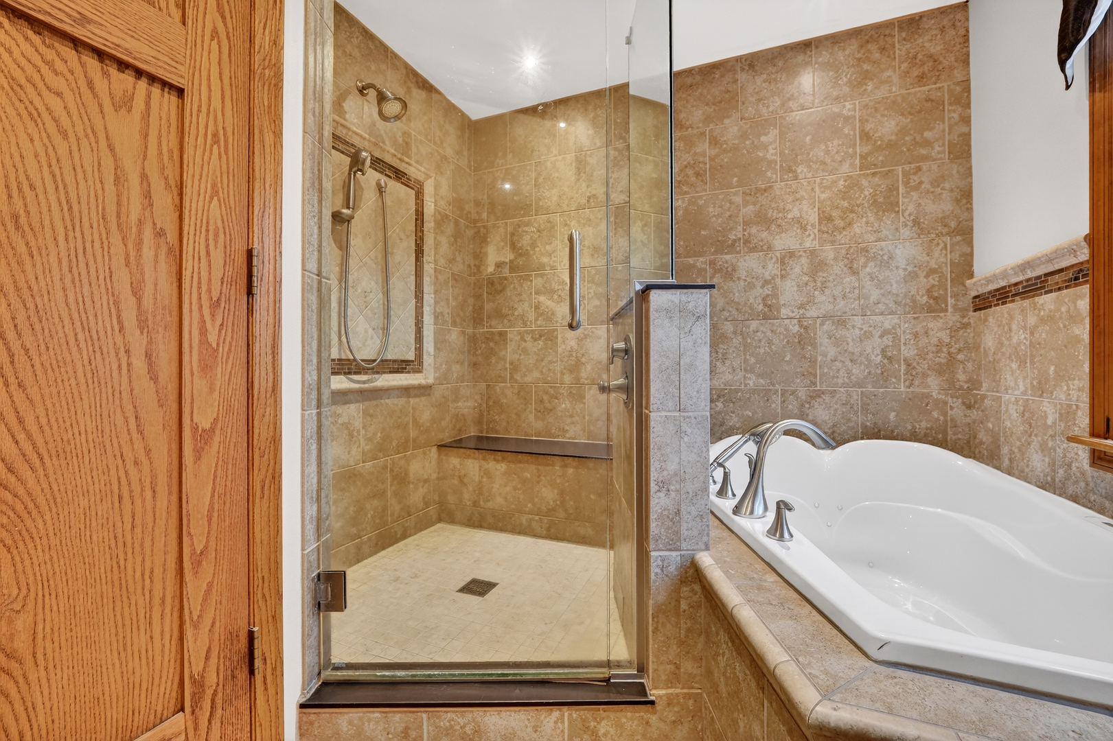 21230 Virginia Road DeKalb, IL 60115 - Photo 48 of 54 a bathroom with a bathtub and a shower