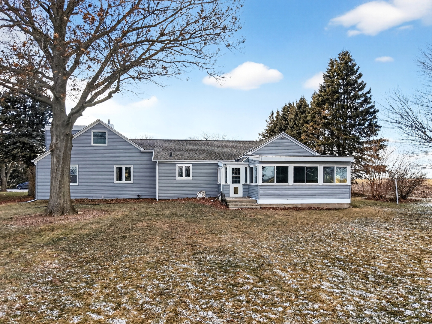 21230 Virginia Road DeKalb, IL 60115 - Photo 5 of 54 a front view of a house with a yard