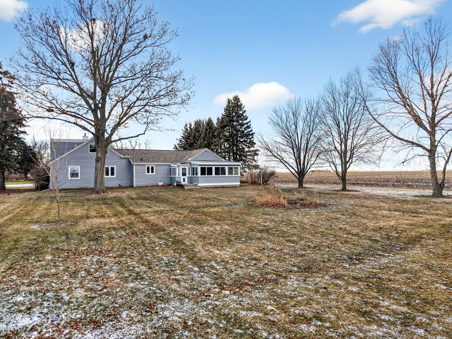 21230 Virginia Road DeKalb, IL 60115 - Photo 6 of 54 a front view of house with yard and trees