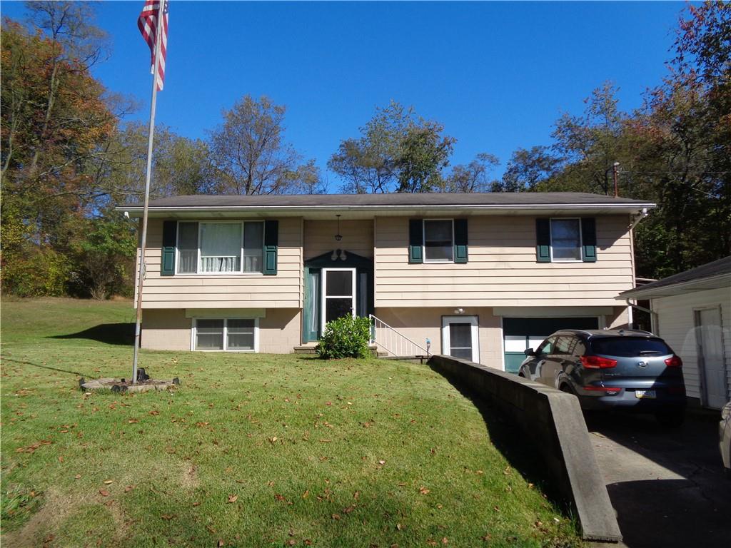 204 Gilchrist Road Uniontown, PA 15401 - Photo 2 of 22 a front view of a house with a yard