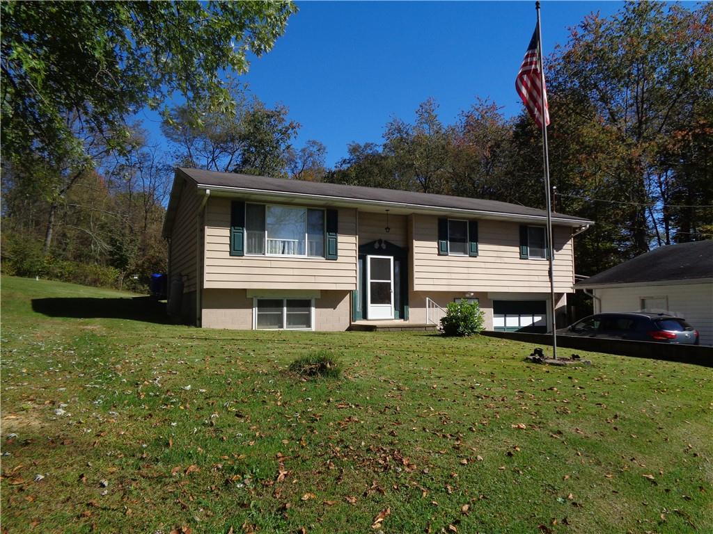 204 Gilchrist Road Uniontown, PA 15401 - Photo 3 of 22 a front view of a house with a garden