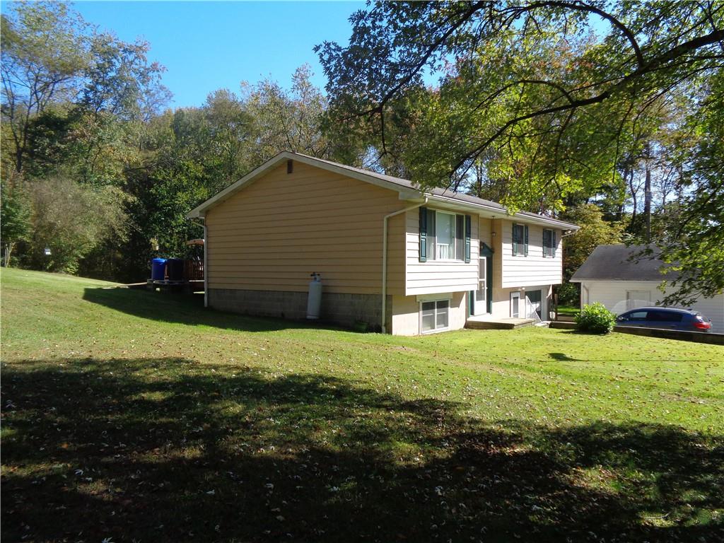 204 Gilchrist Road Uniontown, PA 15401 - Photo 4 of 22 a front view of house with yard and green space