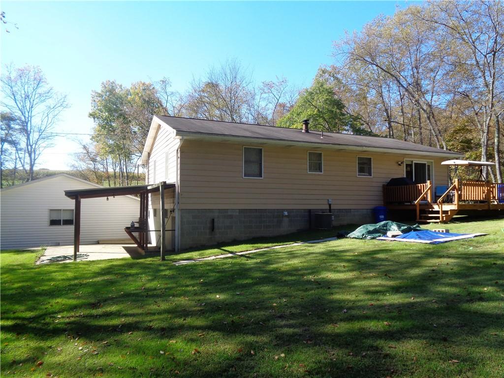 204 Gilchrist Road Uniontown, PA 15401 - Photo 7 of 22 a view of a backyard with table and chairs and potted plants