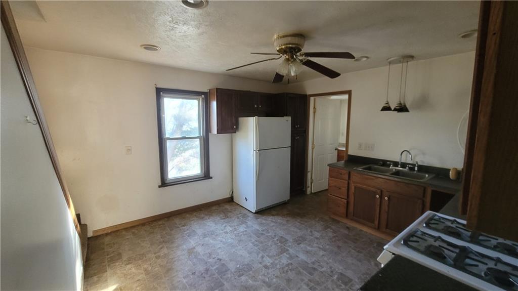 178 Washington Street Freeport, PA 16229 - Photo 6 of 17 wooden floor and chandelier in a kitchen