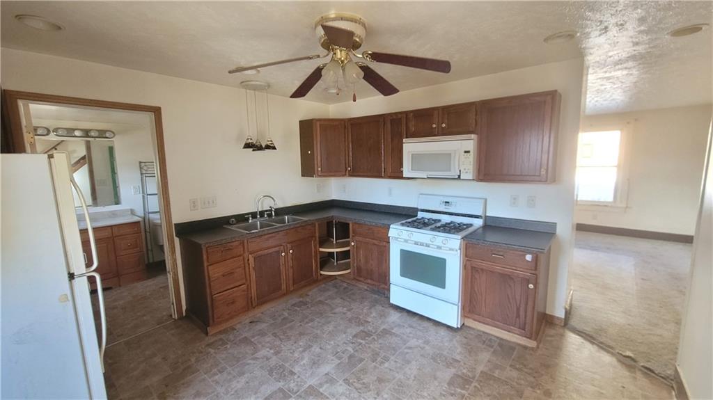 178 Washington Street Freeport, PA 16229 - Photo 7 of 17 a kitchen with stainless steel appliances granite countertop a sink stove and refrigerator