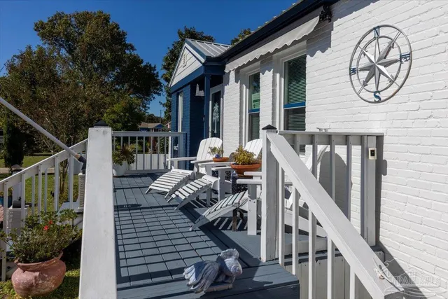 a view of balcony with furniture
