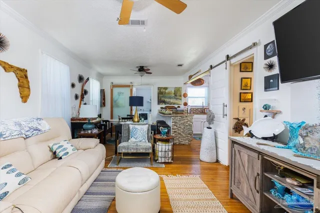 a living room with fireplace furniture and a flat screen tv