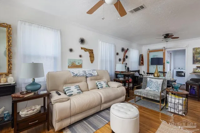 a living room with furniture and a rug