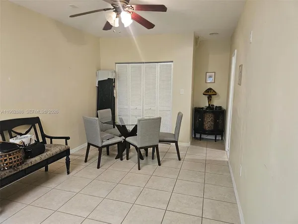 a view of a livingroom with furniture and a window
