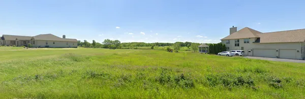a view of a lake with a house in the background