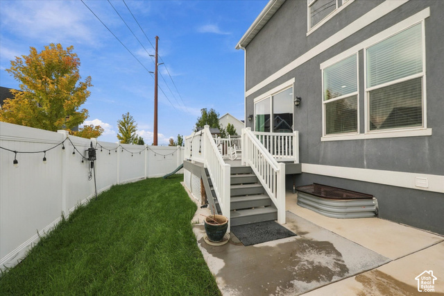 972 Vine Street Mapleton, UT 84664 - Photo 37 of 40 Manicured lawn area with white privacy fencing