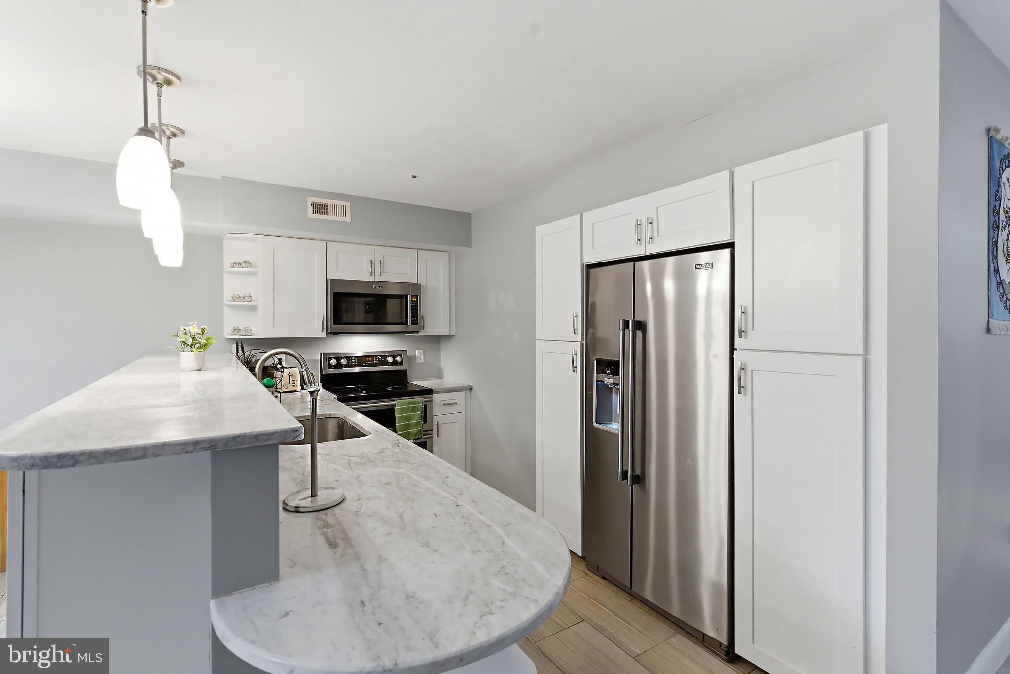 3036 Main Street, Unit 3036 Voorhees, NJ 08043 - Photo 6 of 24 Modern kitchen with sleek finishes.