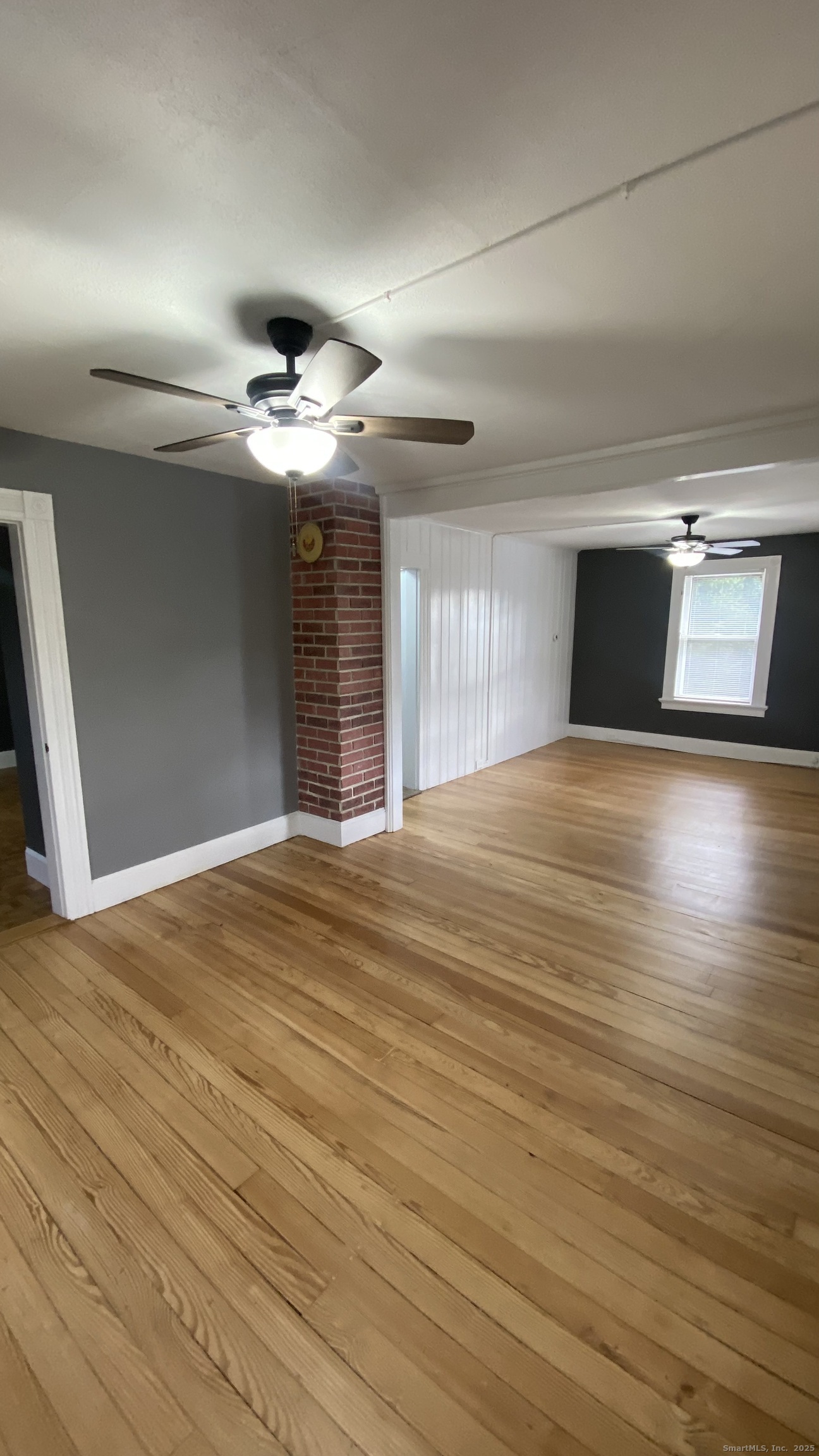 26 Pine Street, Unit 2 Torrington, CT 06790 - Photo 12 of 36 a view of an empty room and wooden floor