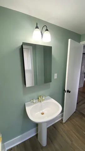 a bathroom with a sink and mirror