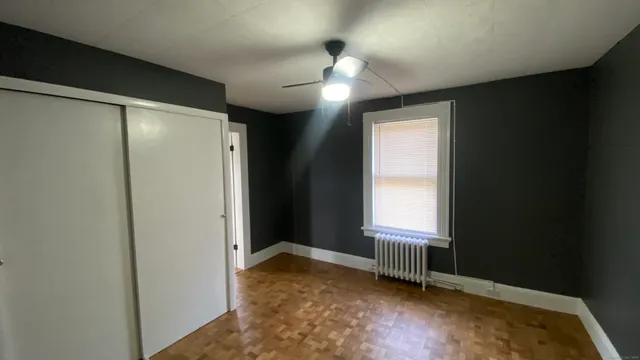 a view of an empty room with a window