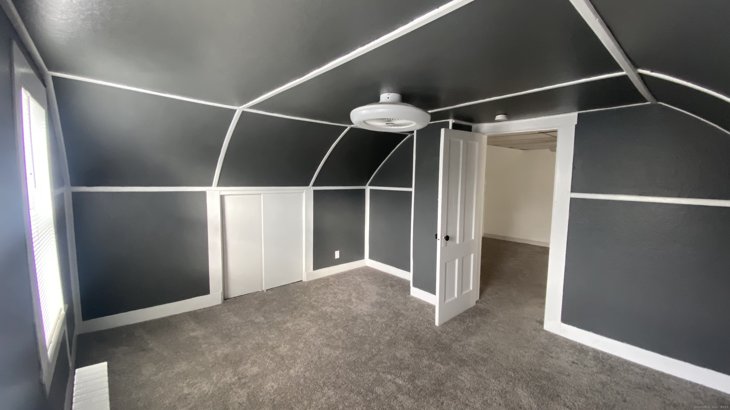 26 Pine Street, Unit 2 Torrington, CT 06790 - Photo 26 of 36 a view of an empty room with a window