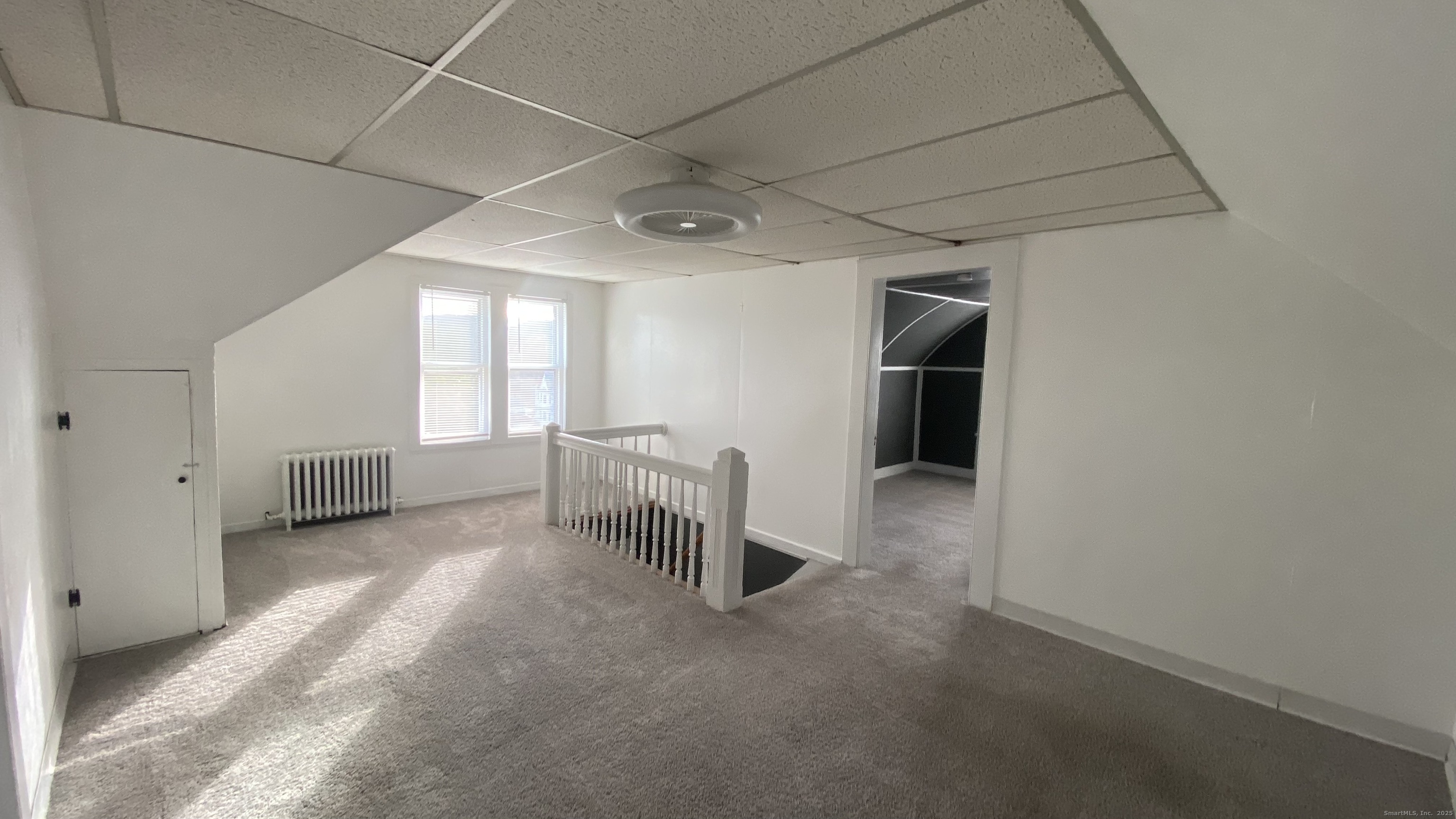 26 Pine Street, Unit 2 Torrington, CT 06790 - Photo 28 of 36 a view of a livingroom with furniture and a window