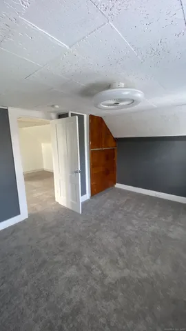 a view of an empty room with stairs