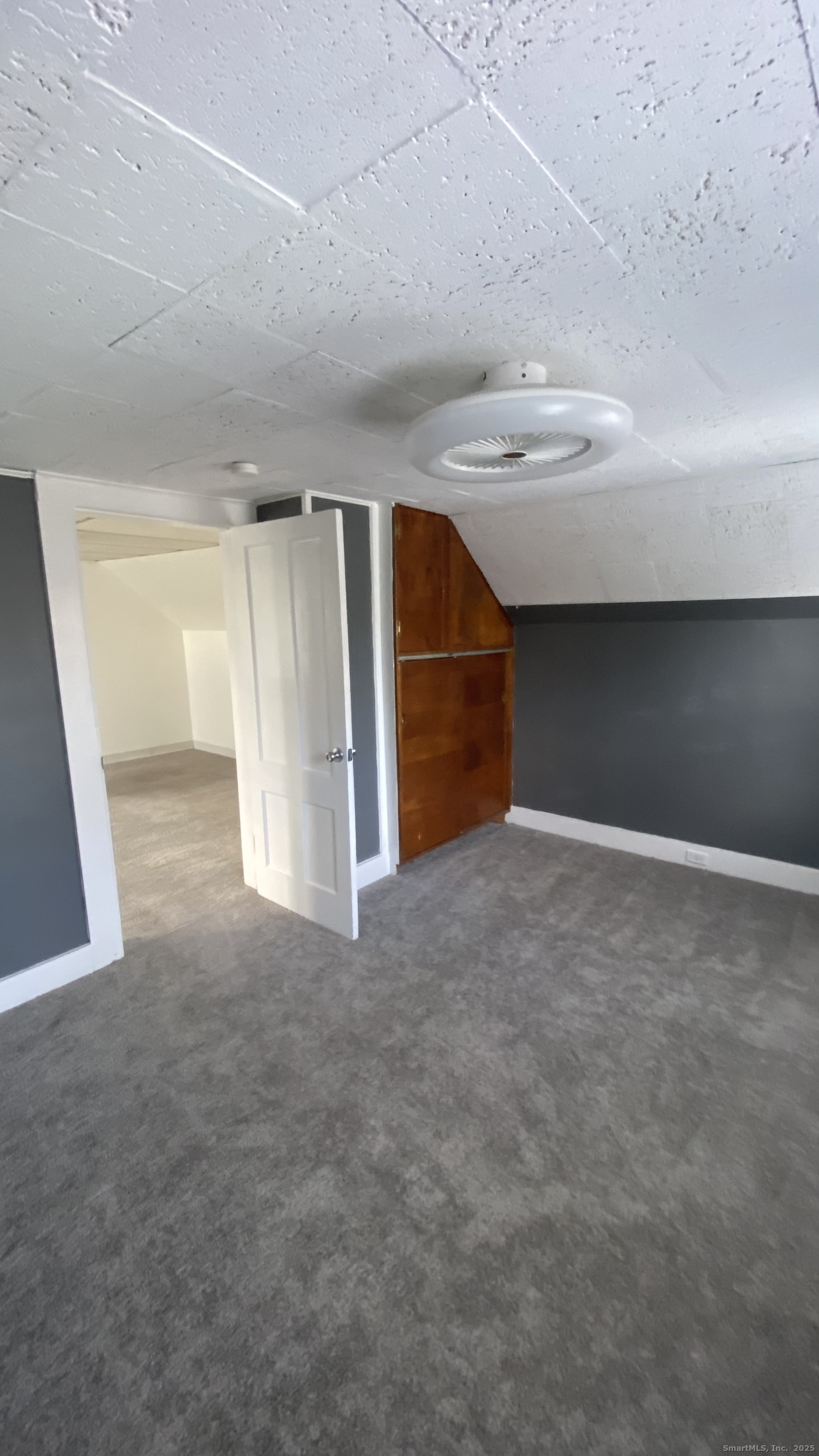 26 Pine Street, Unit 2 Torrington, CT 06790 - Photo 31 of 36 a view of an empty room with stairs