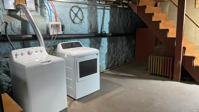 a utility room with dryer and washer