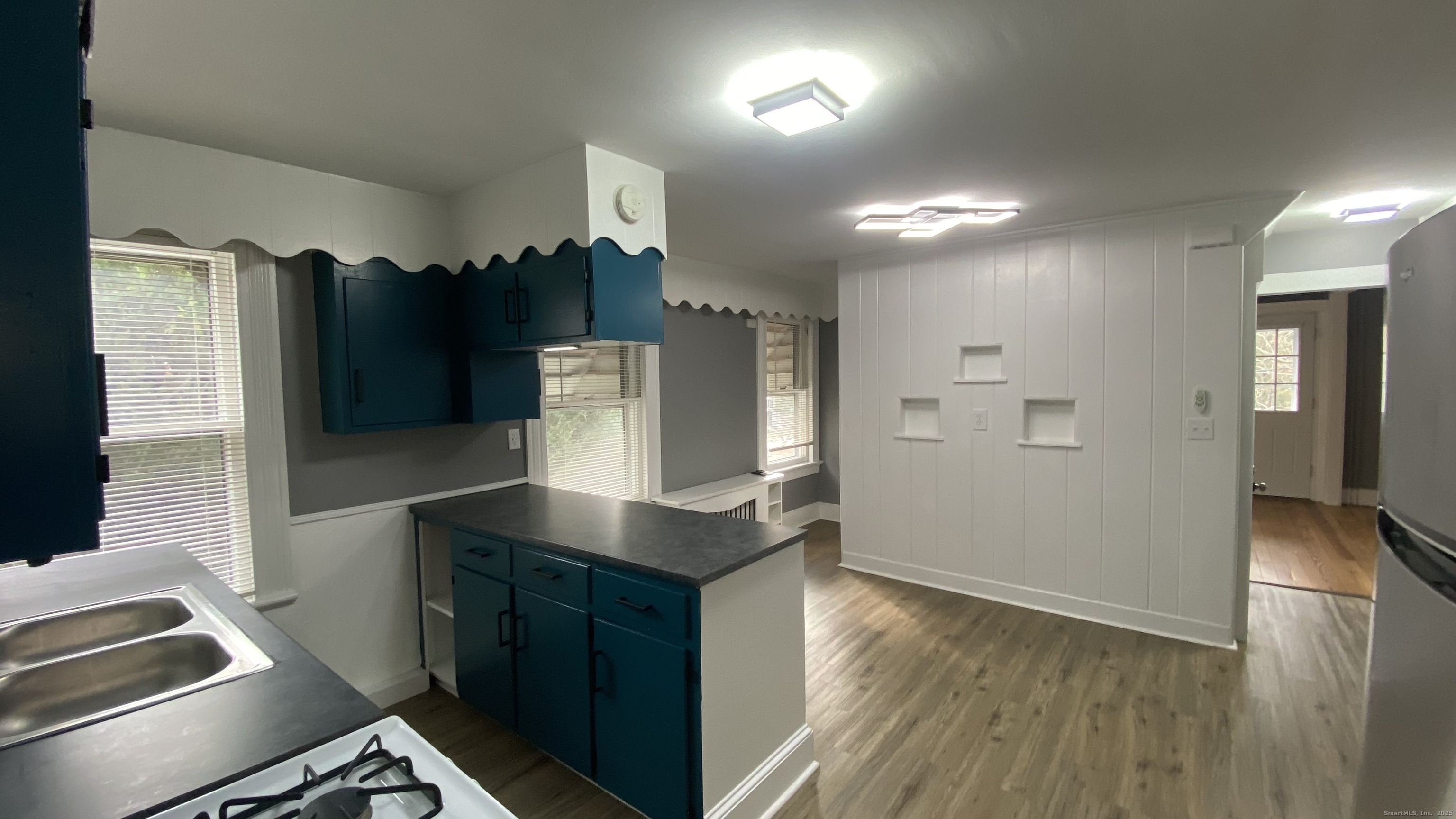 26 Pine Street, Unit 2 Torrington, CT 06790 - Photo 8 of 36 a kitchen with refrigerator and window