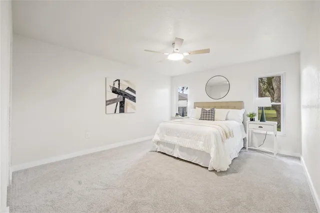 a bedroom with a bed and window