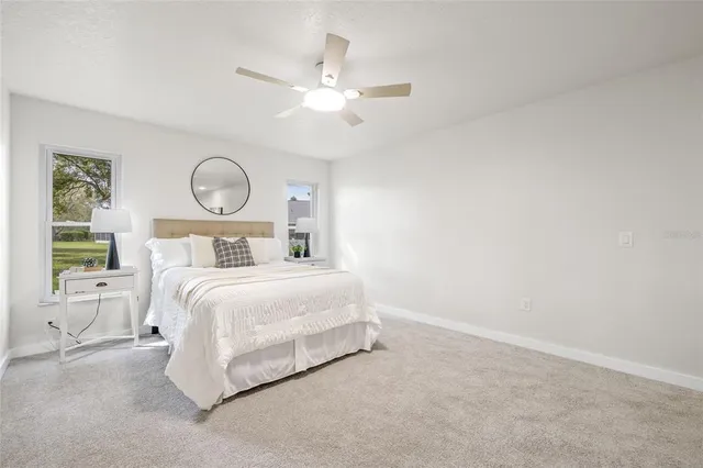 a bedroom with a bed and window