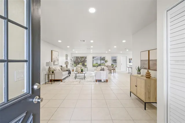 a view of a living room and kitchen view