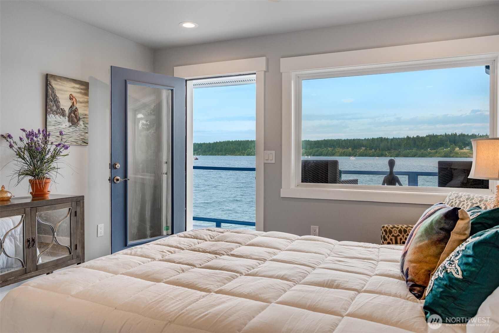 5341 South Bercot Road Freeland, WA 98249 - Photo 21 of 37 a bedroom with a bed and large windows
