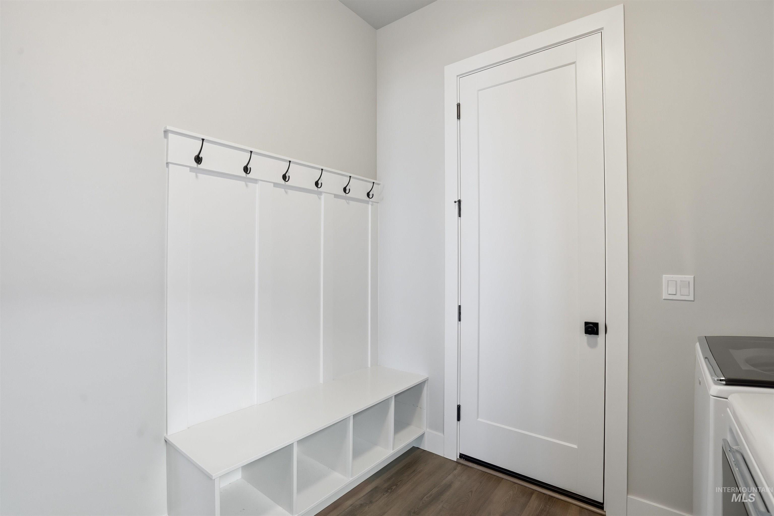 2976 East Parulo Drive Meridian, ID 83642 - Photo 17 of 40 Mudroom with dark wood-type flooring and independent washer and dryer