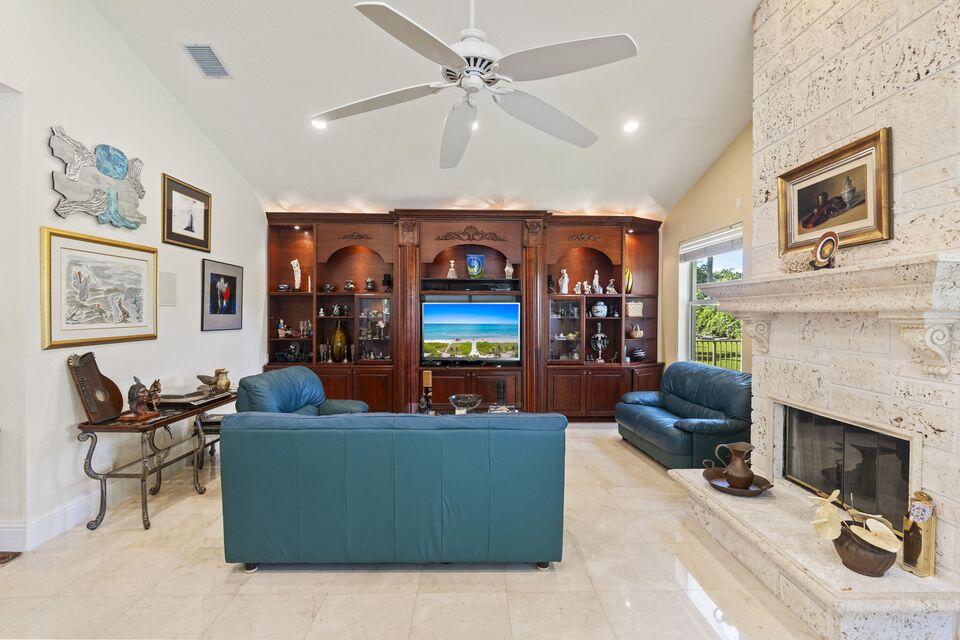 3271 Harrington Drive Boca Raton, FL 33496 - Photo 12 of 43 a living room with furniture and a fireplace