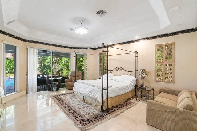 a large white kitchen with a large window