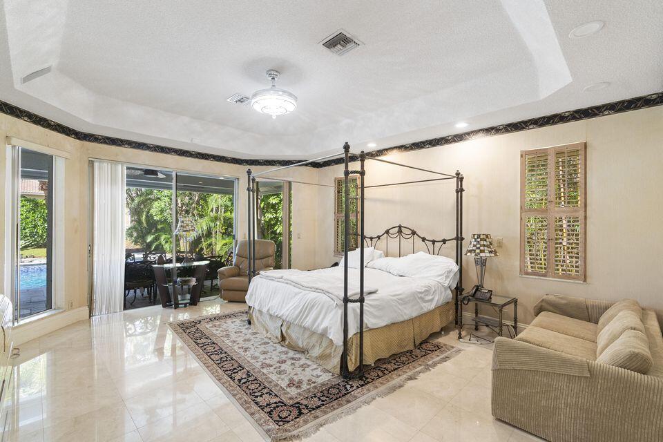 3271 Harrington Drive Boca Raton, FL 33496 - Photo 14 of 43 a bedroom with a large bed couch and a large window