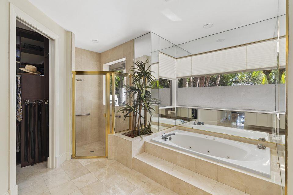 3271 Harrington Drive Boca Raton, FL 33496 - Photo 16 of 43 a bathroom with a tub and a shower