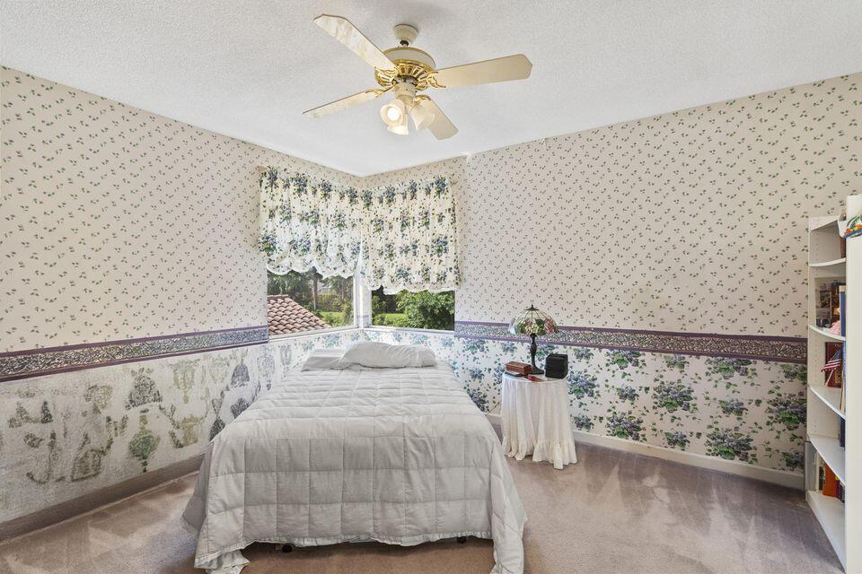 3271 Harrington Drive Boca Raton, FL 33496 - Photo 19 of 43 a bedroom with a bed and window