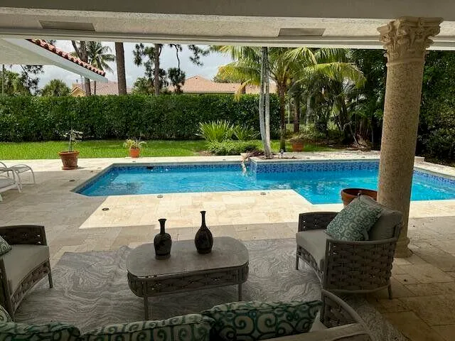 a outdoor space with patio the couches and potted plants