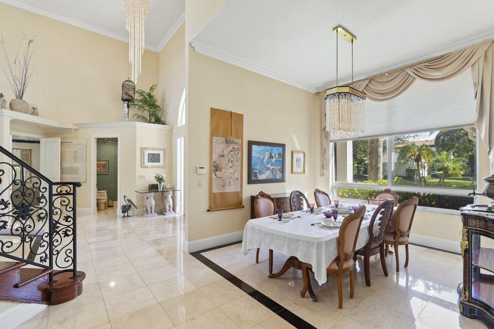 3271 Harrington Drive Boca Raton, FL 33496 - Photo 7 of 43 a view of a dining room with furniture window and wooden floor