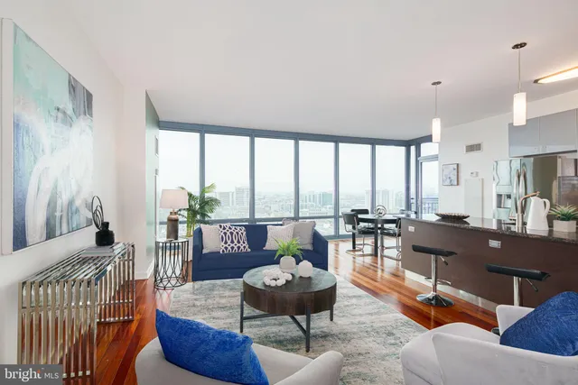 a living room with furniture and a large window
