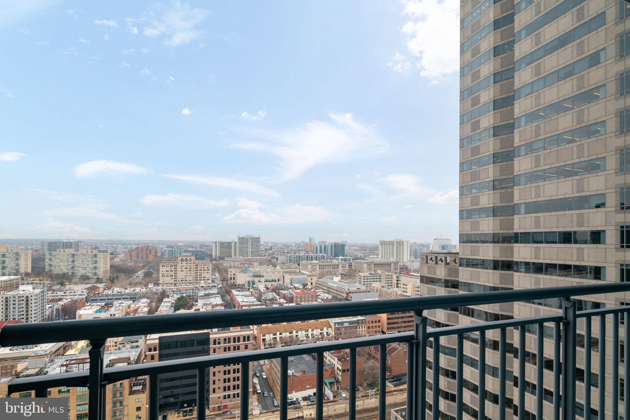 2101 Market Street, Unit 1901 Philadelphia, PA 19103 - Photo 11 of 25 a view of a city skyline from a balcony