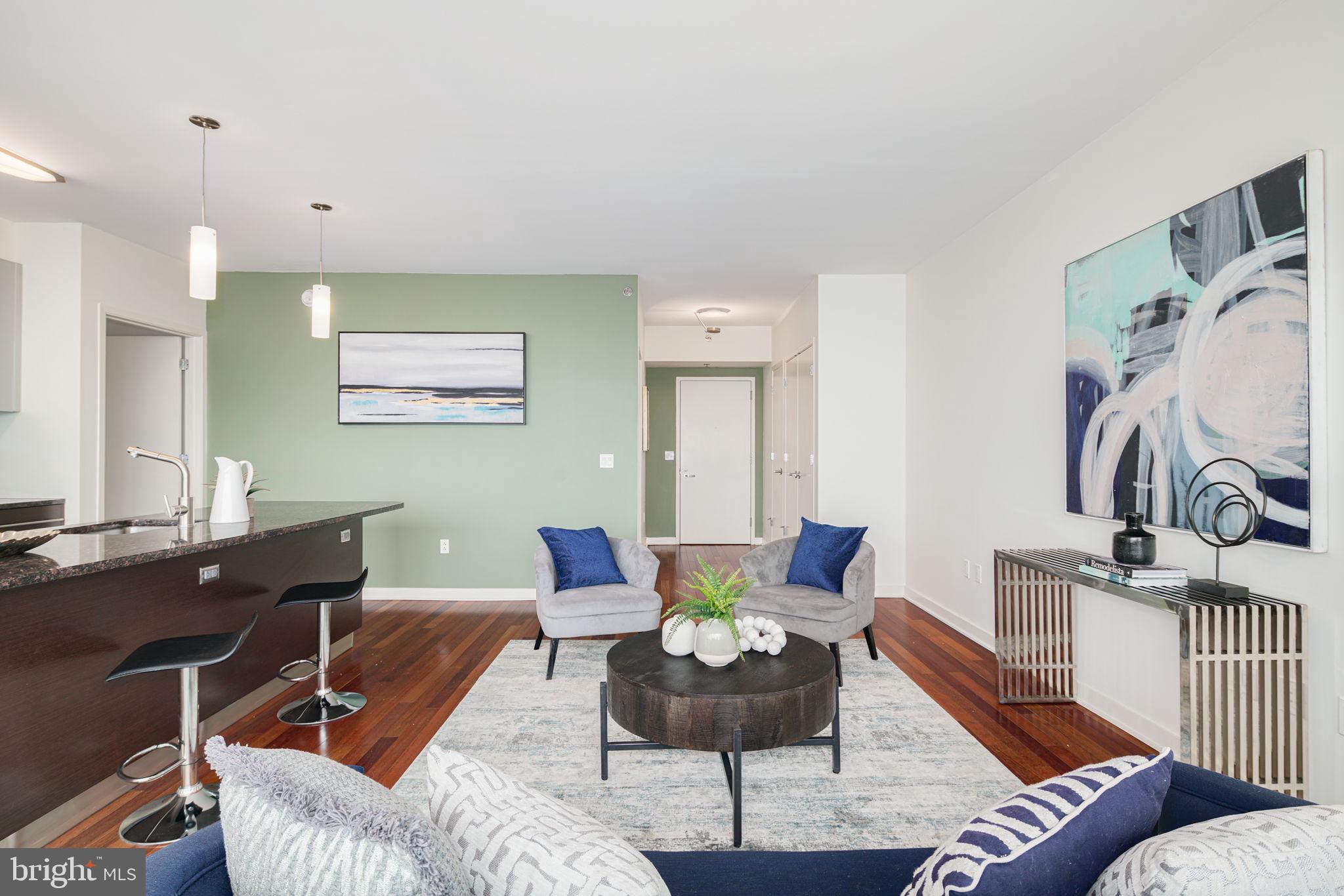 2101 Market Street, Unit 1901 Philadelphia, PA 19103 - Photo 5 of 25 a view of a livingroom with furniture and a couch
