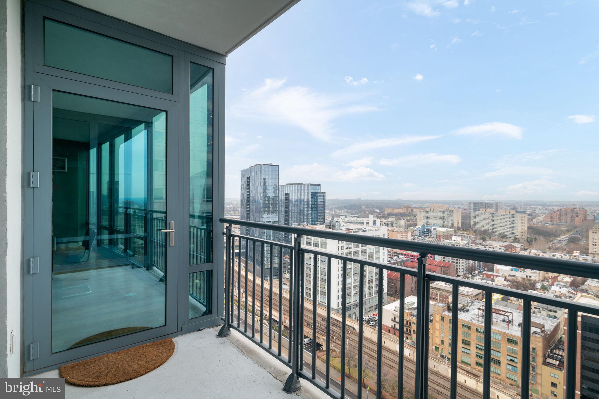 2101 Market Street, Unit 1901 Philadelphia, PA 19103 - Photo 10 of 25 a view of a city from a balcony