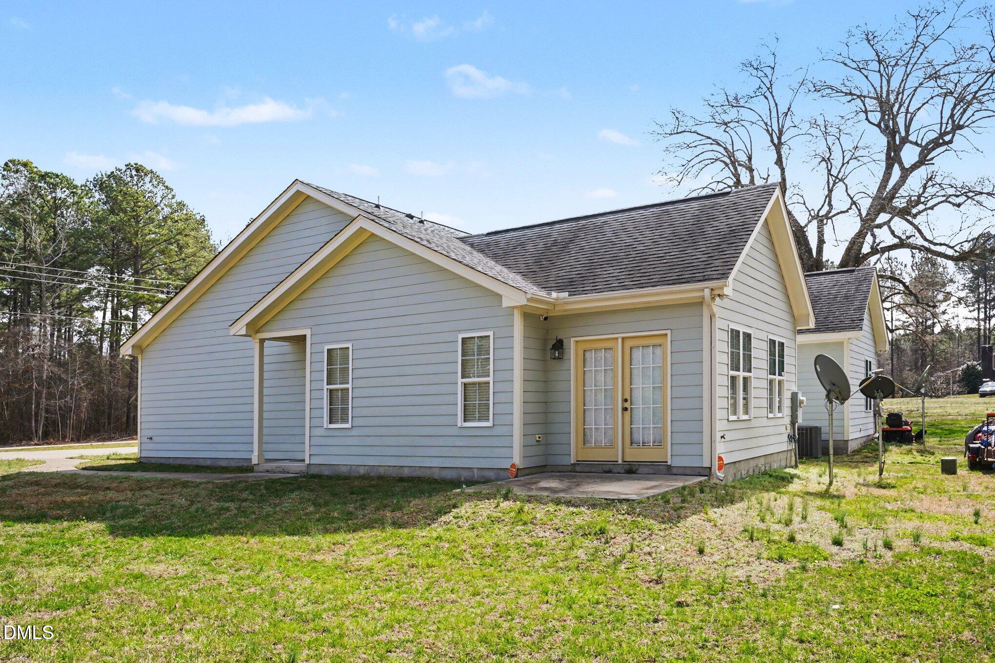 1471 Thanksgiving Fire Road Selma, NC 27576 - Photo 15 of 16 a view of a house with a yard