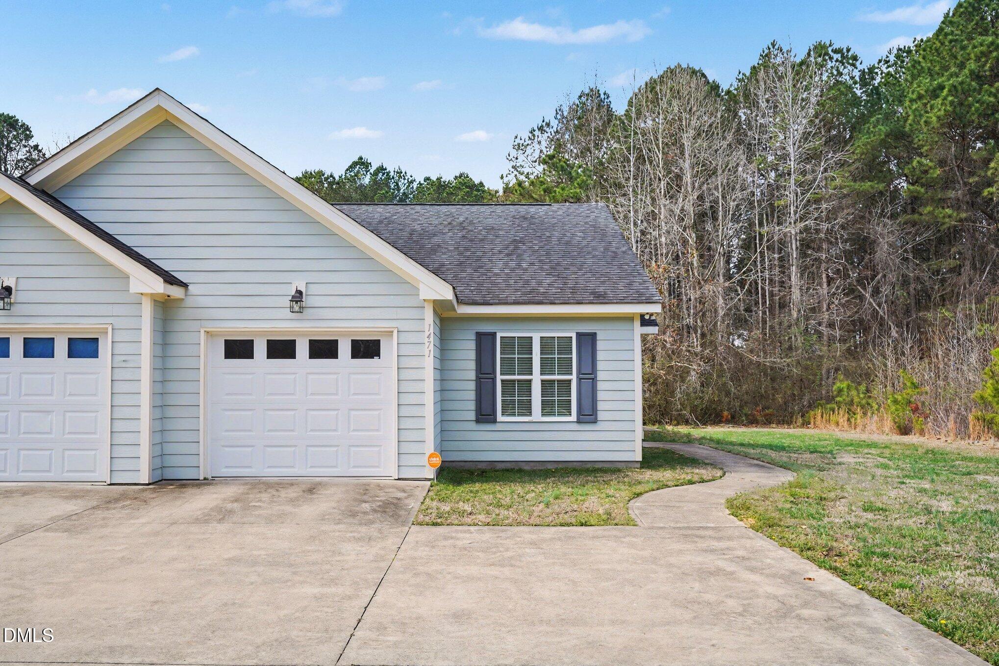1471 Thanksgiving Fire Road Selma, NC 27576 - Photo 2 of 16 a view of backyard of house with trees