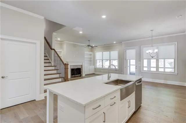 a kitchen with a stove a sink and a refrigerator