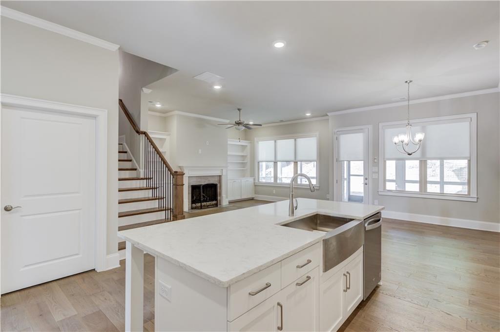 5630 Overlook Club Circle Suwanee, GA 30024 - Photo 12 of 32 a kitchen with a stove a sink and a refrigerator