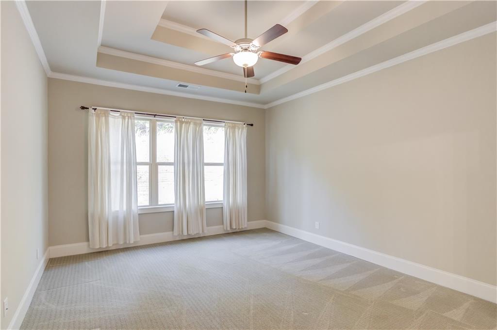 5630 Overlook Club Circle Suwanee, GA 30024 - Photo 14 of 32 an empty room with windows and ceiling fan