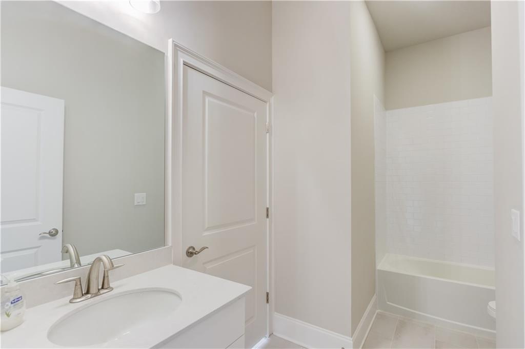 5630 Overlook Club Circle Suwanee, GA 30024 - Photo 20 of 32 a bathroom with a sink and a tub