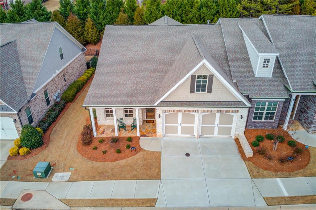 5630 Overlook Club Circle Suwanee, GA 30024 - Photo 2 of 32 an aerial view of a house with swimming pool and porch