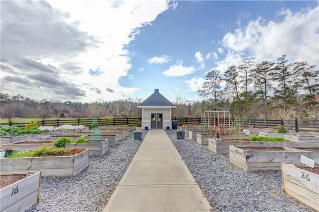 a view of a swimming pool and lounge chairs