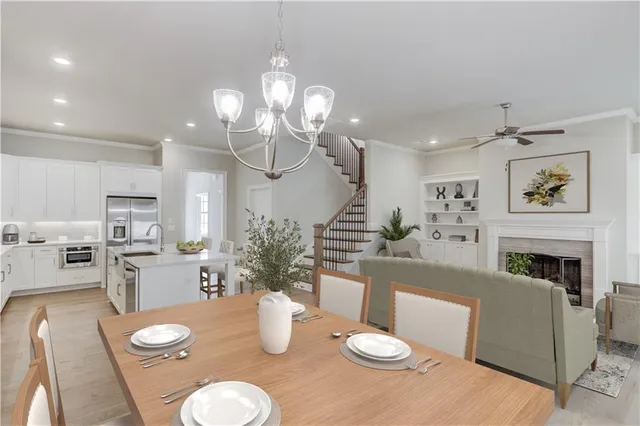 a kitchen with furniture and wooden floor